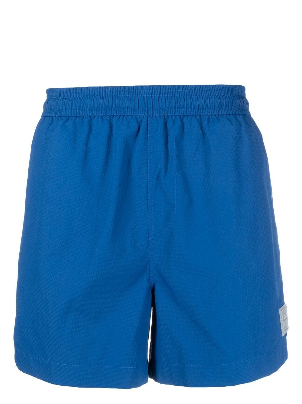 A-COLD-WALL* logo-patch swim shorts - Blue von A-COLD-WALL*