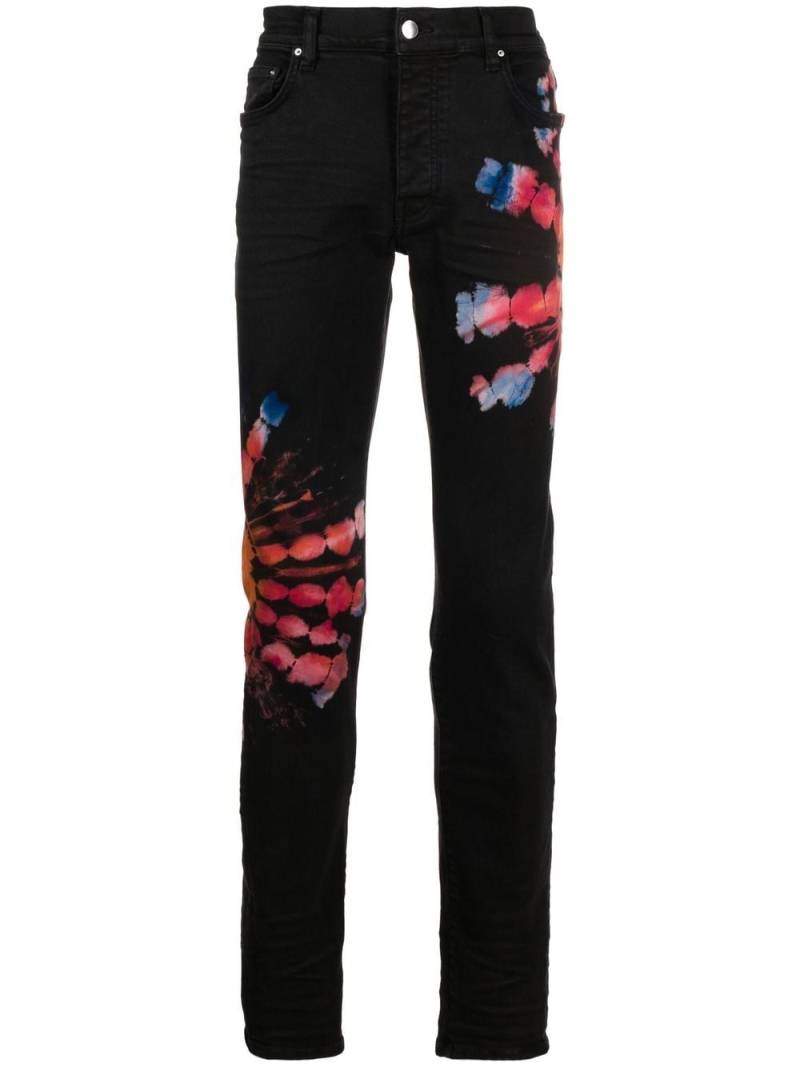 AMIRI tie-dye print skinny jeans - Black von AMIRI