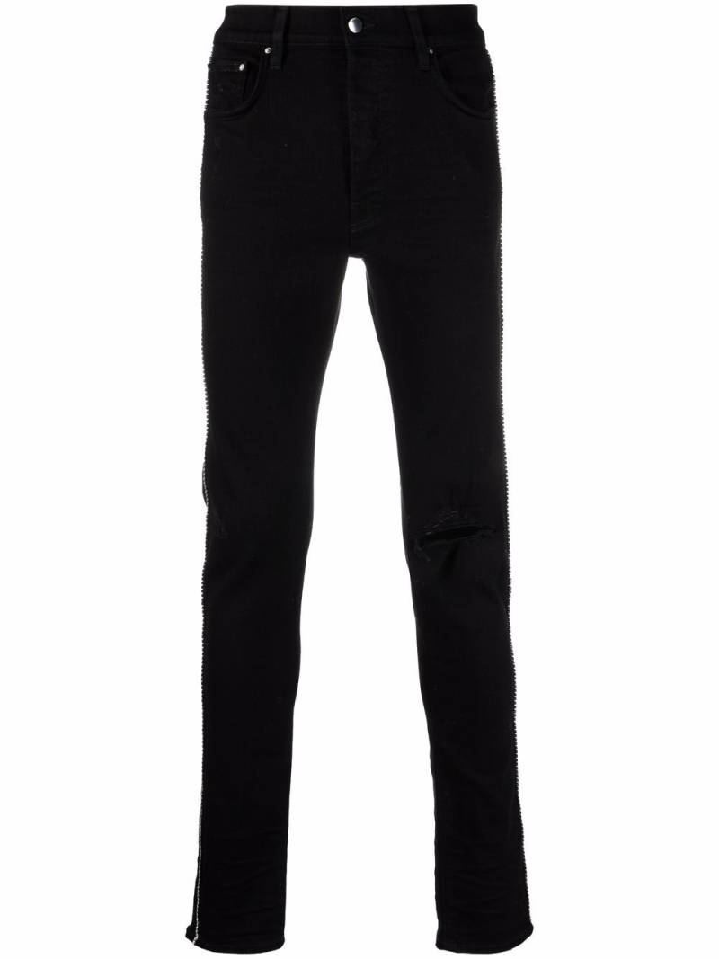 AMIRI ripped-detail jeans - Black von AMIRI