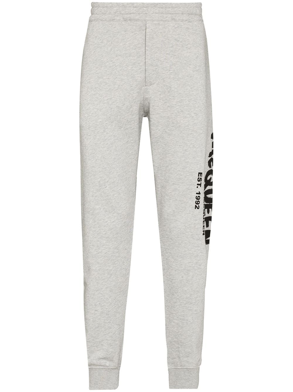 Alexander McQueen graffiti-print track pants - Grey von Alexander McQueen