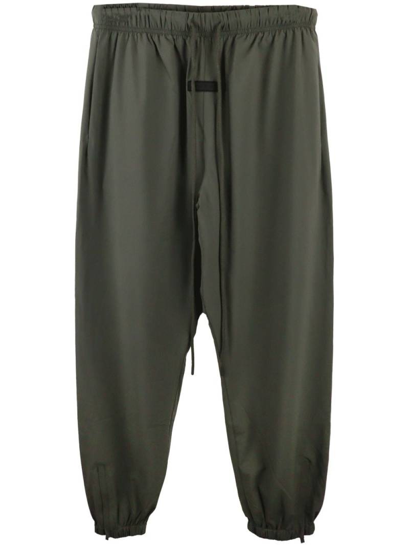 FEAR OF GOD ESSENTIALS drop-crotch track pants - Green von FEAR OF GOD ESSENTIALS