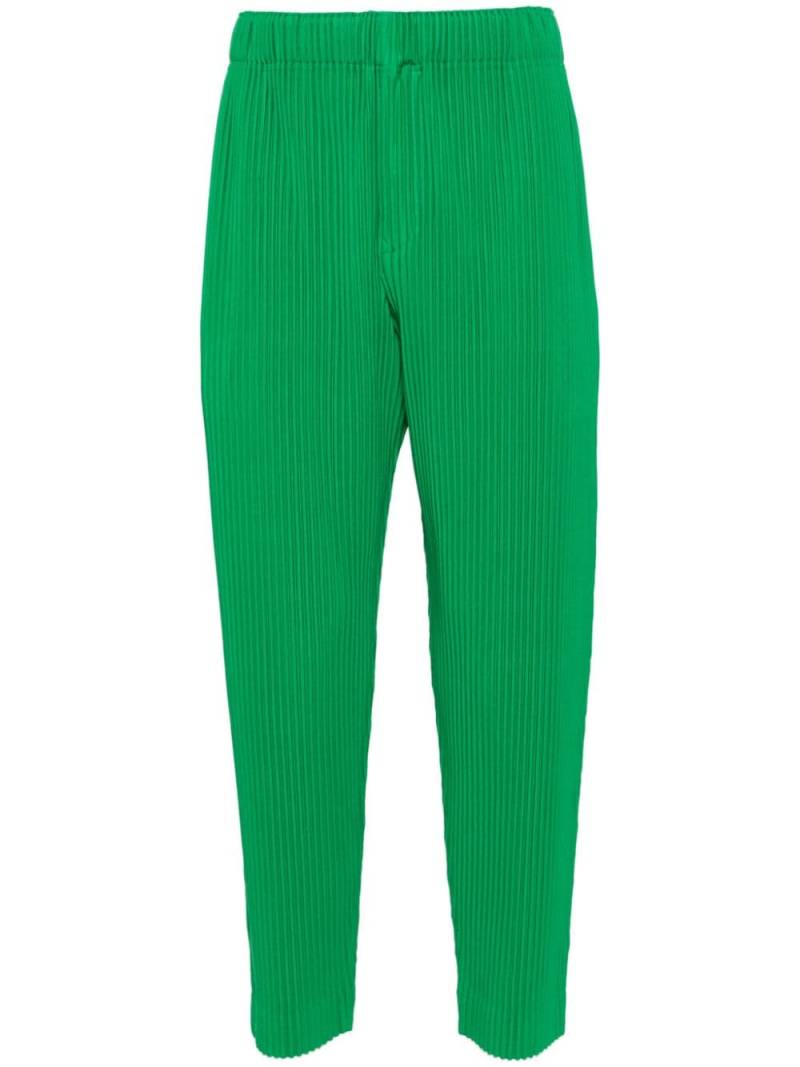 Homme Plissé Issey Miyake pleated tapered trousers - Green von Homme Plissé Issey Miyake