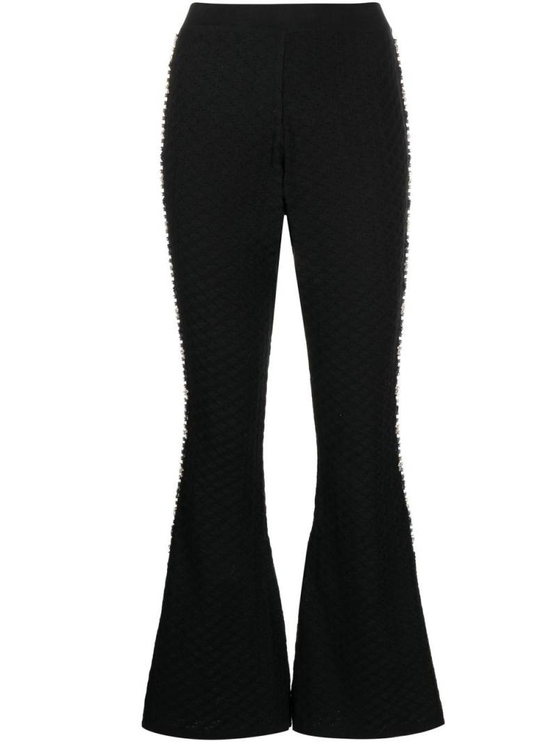 Izaak Azanei knitted embellished flared trousers - Black von Izaak Azanei