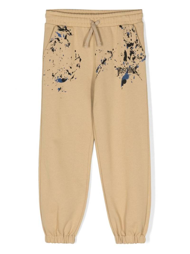 Moschino Kids paint-splatter logo-print track pants - Brown von Moschino Kids