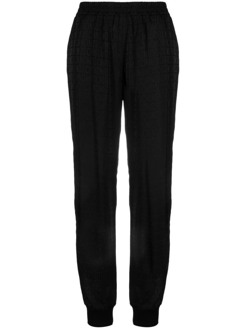 Moschino all over logo-print track trousers - Black von Moschino