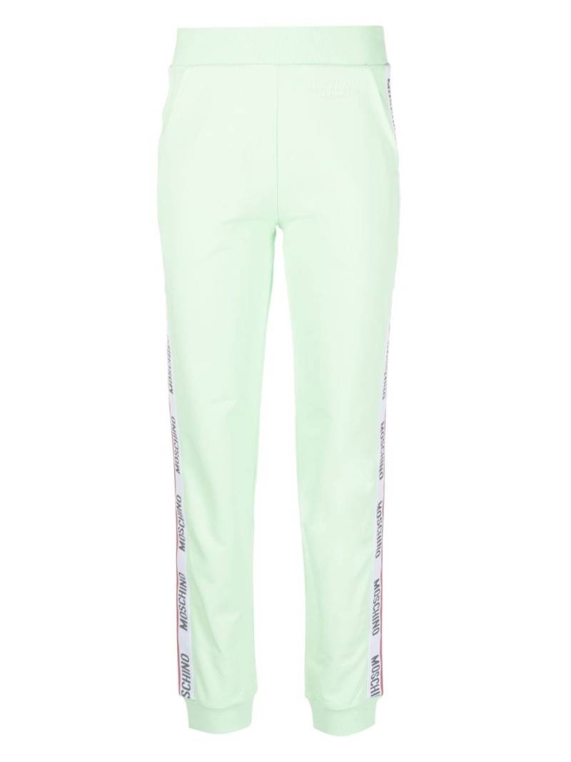 Moschino embossed-logo jersey trousers - Green von Moschino