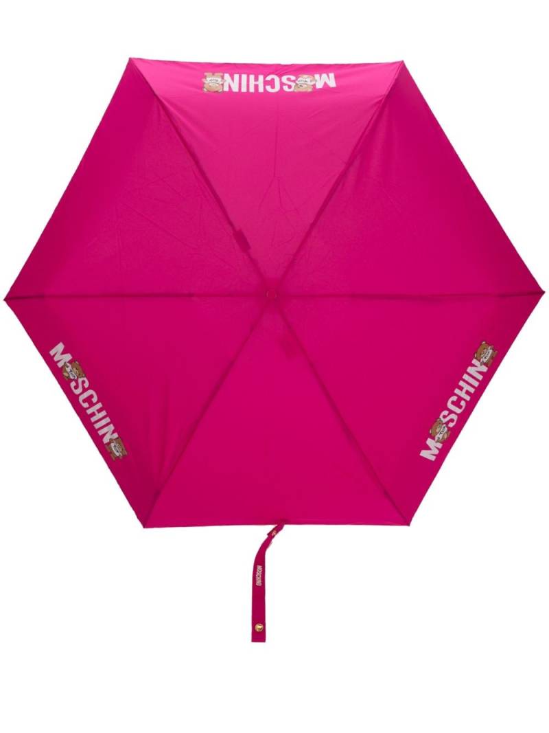 Moschino logo-print compact umbrella - Pink von Moschino