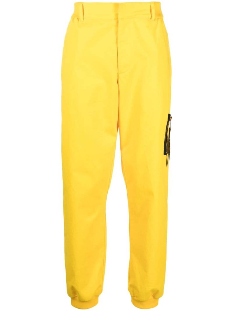 Moschino tapered stretch-cotton trousers - Yellow von Moschino
