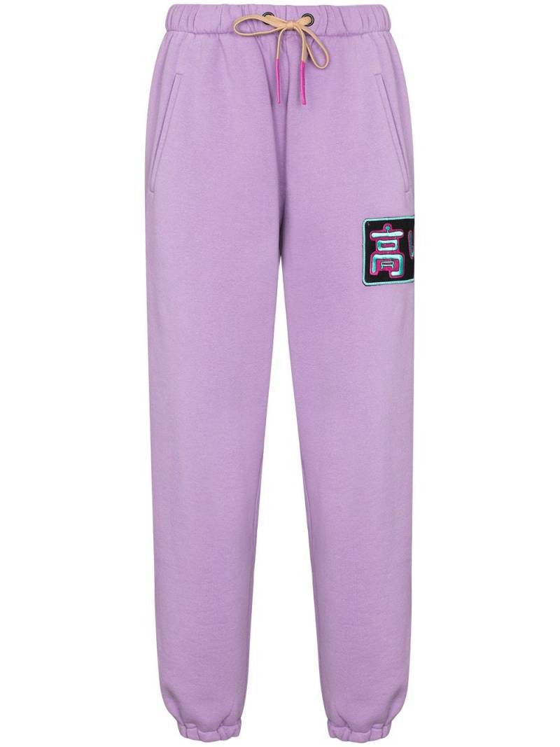 Natasha Zinko logo-patch tapered-fit track pants - Purple von Natasha Zinko