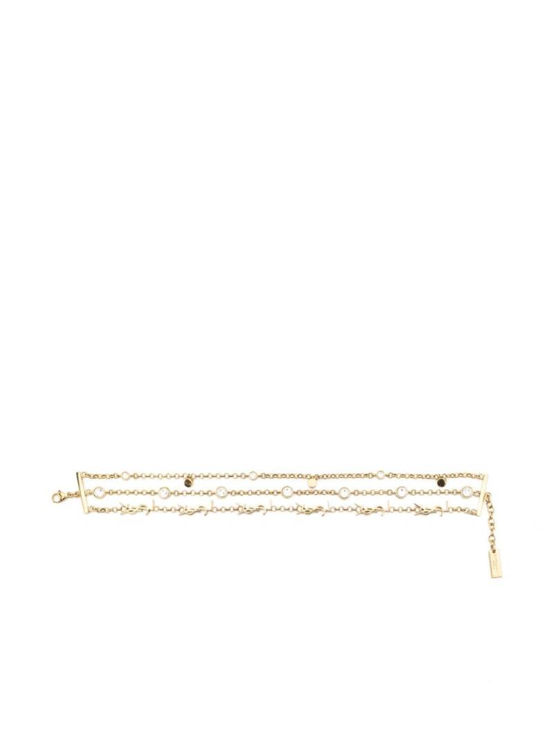 Saint Laurent Cassandre crystal-embellished bracelet - Gold von Saint Laurent