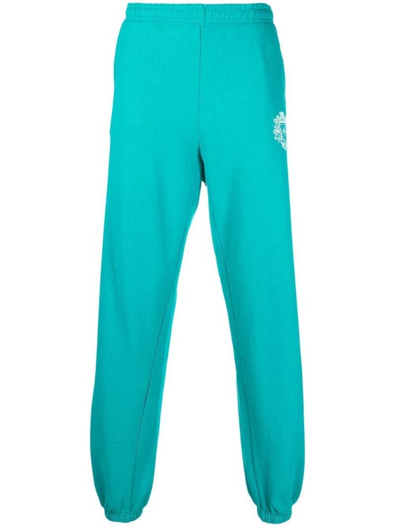 Sporty & Rich crest logo print track pants - Blue von Sporty & Rich