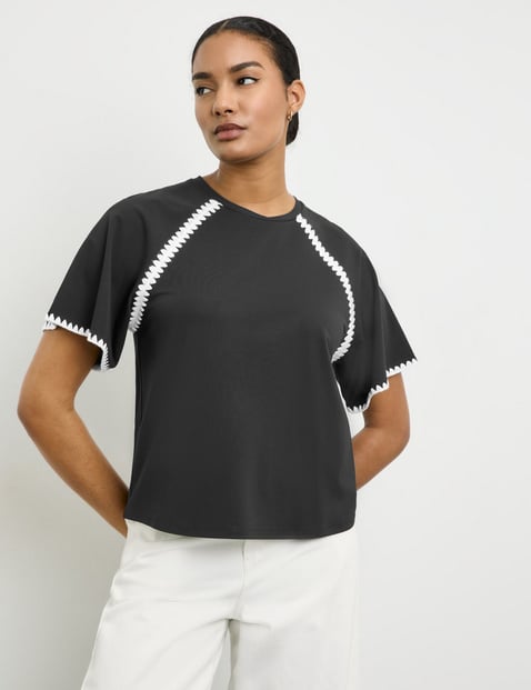 TAIFUN Damen Kurzarmshirt mit dekorativem Kontrast-Stitching 60cm Raglanarm Rundhals Viskose Schwarz von Taifun