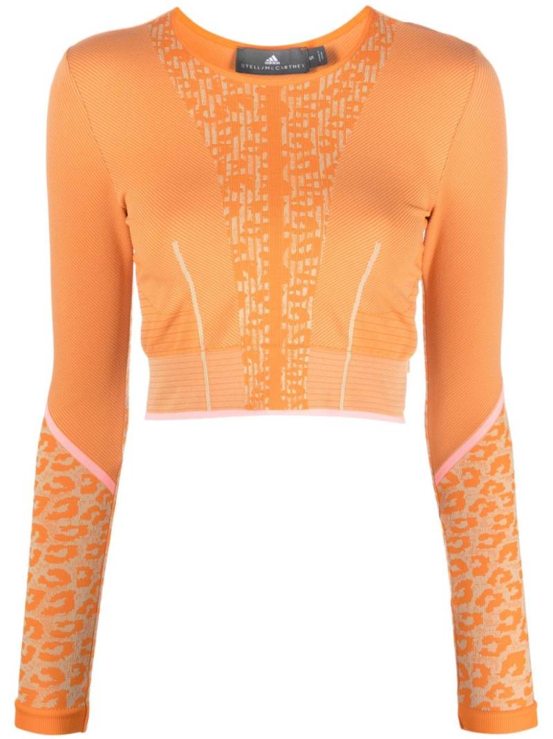 adidas by Stella McCartney TrueStrength seamless long sleeve crop top - Orange von adidas by Stella McCartney